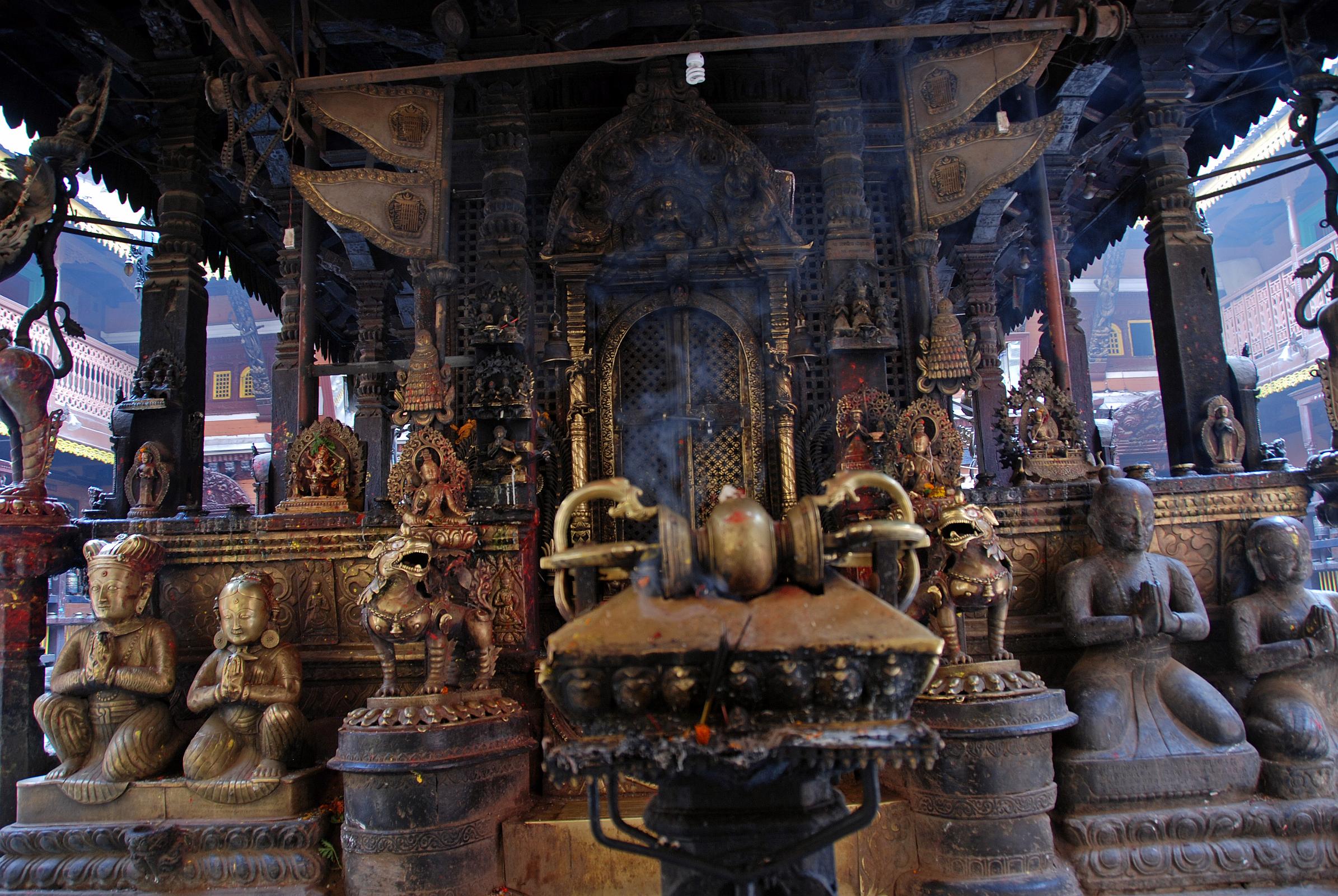 Kathmandu Patan Golden Temple 28 The Entrance Door To The Swayambhu Chaitya Is Guarded By Two Snow Lions And Has A Vajra And Many Statues Including The King And Queen 